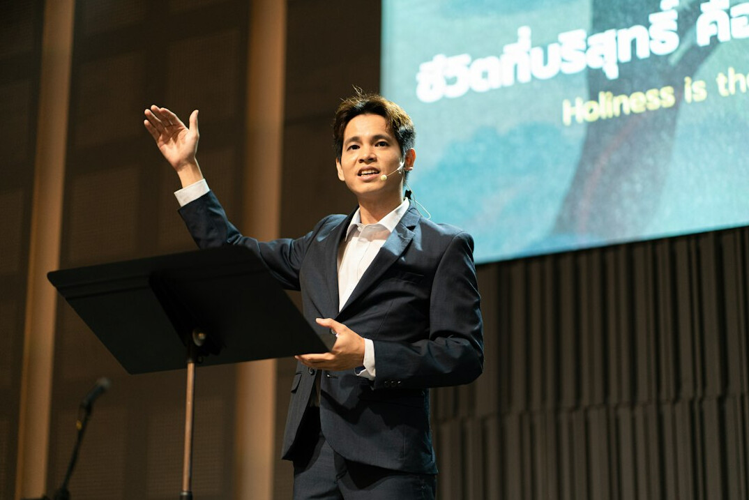 confident speaker in suit